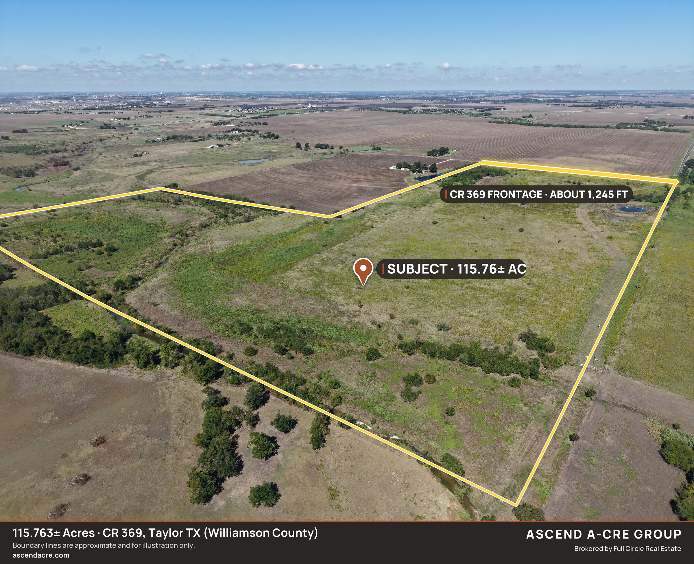 Drone aerial of the whole tract from the south-east with the creek along the south line